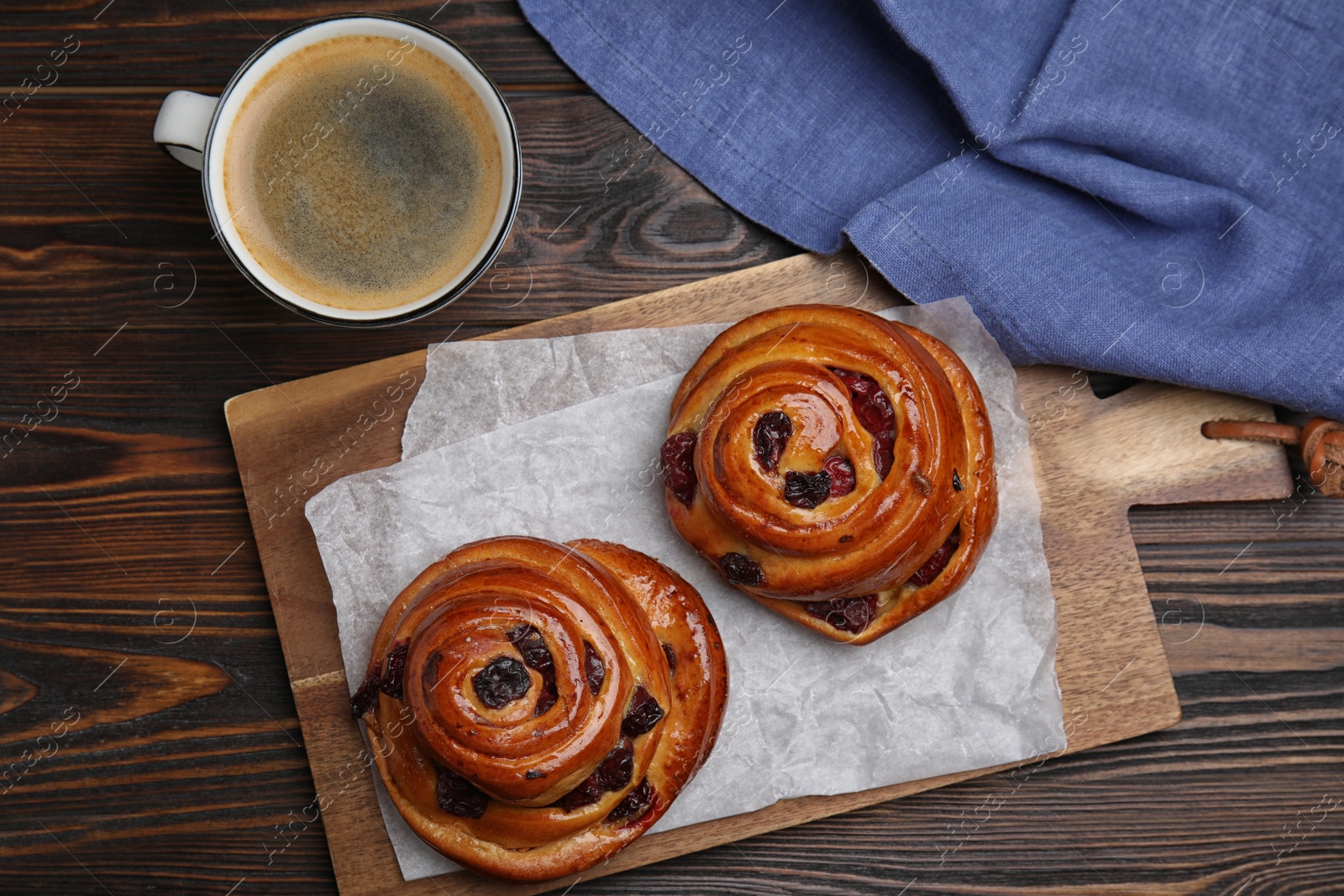 Photo of Delicious pastries and coffee on wooden table, flat lay