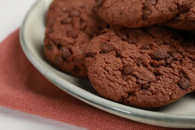 Delicious chocolate chip cookies on white table, closeup