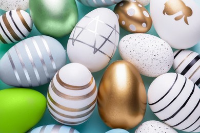 Photo of Beautifully painted Easter eggs as background, top view