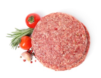 Raw hamburger patties with rosemary, vegetables and pepper on white background, top view