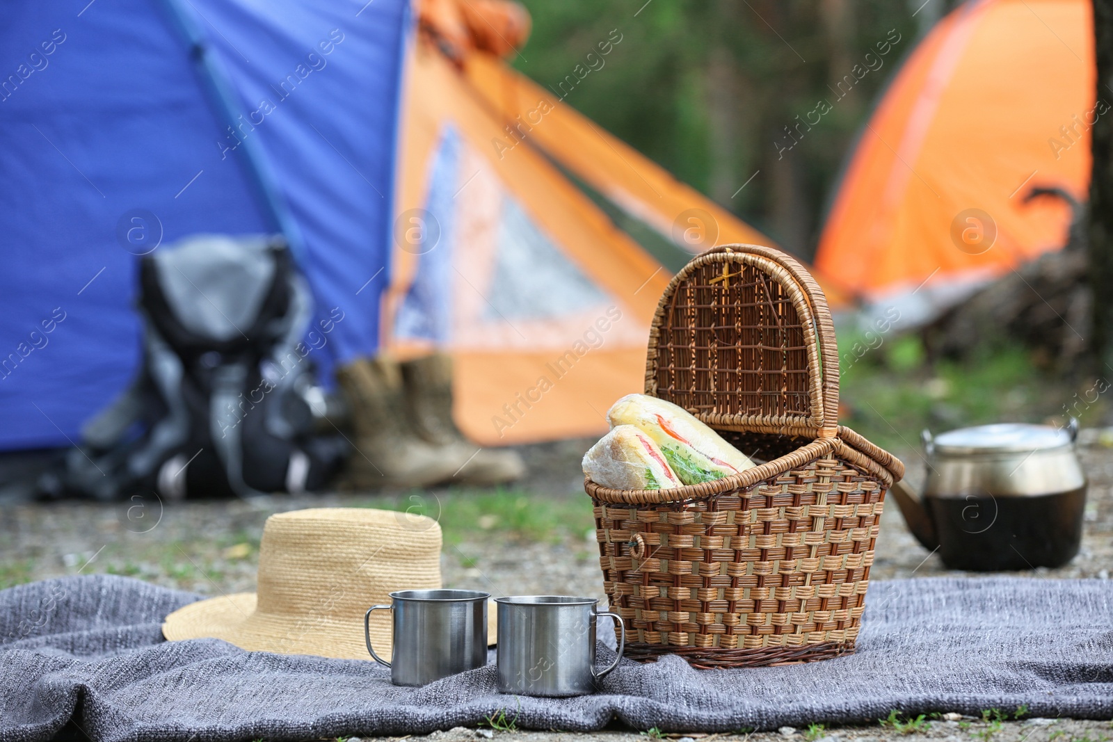 Photo of Set of camping equipment outdoors on summer day