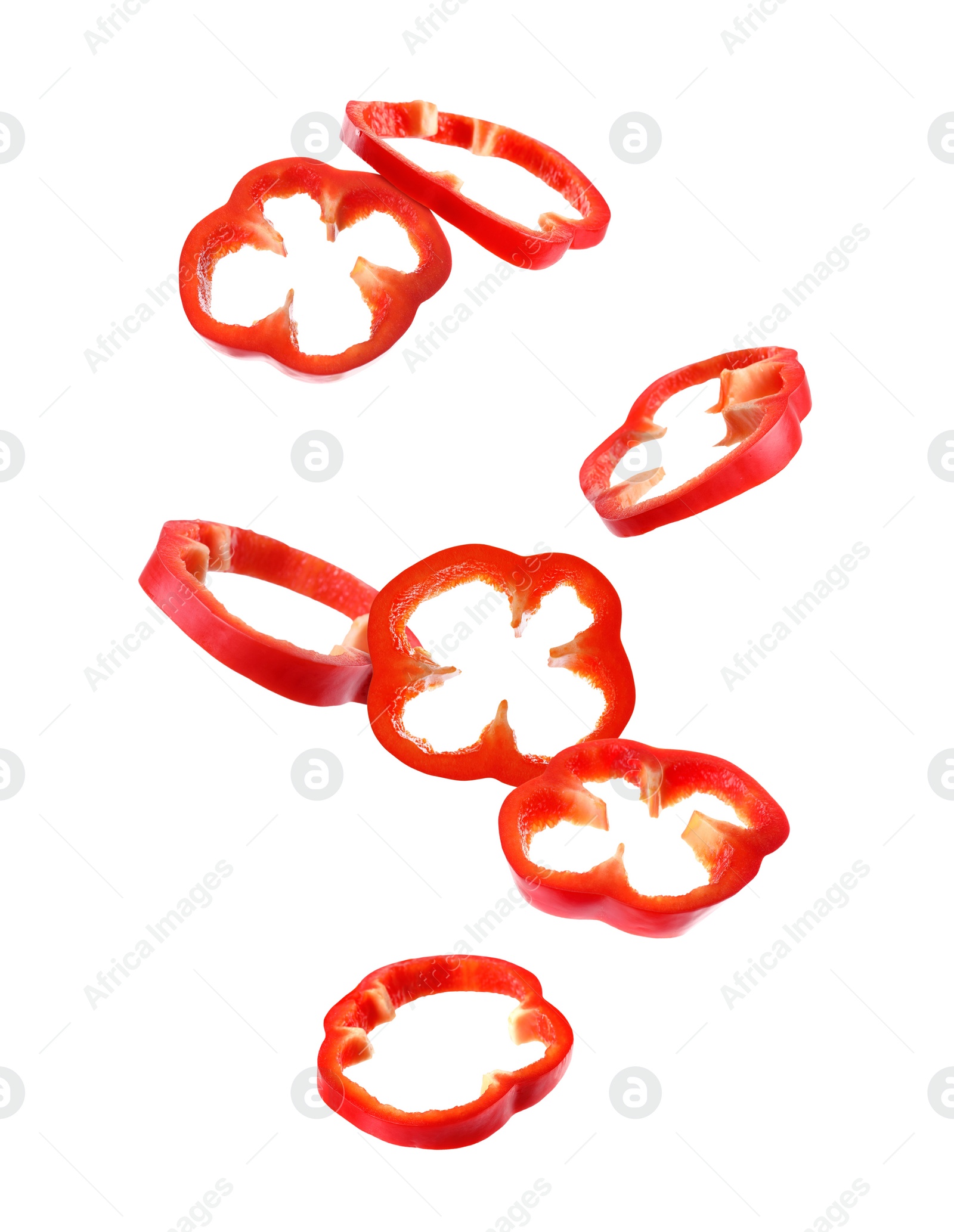 Image of Falling cut red bell peppers on white background