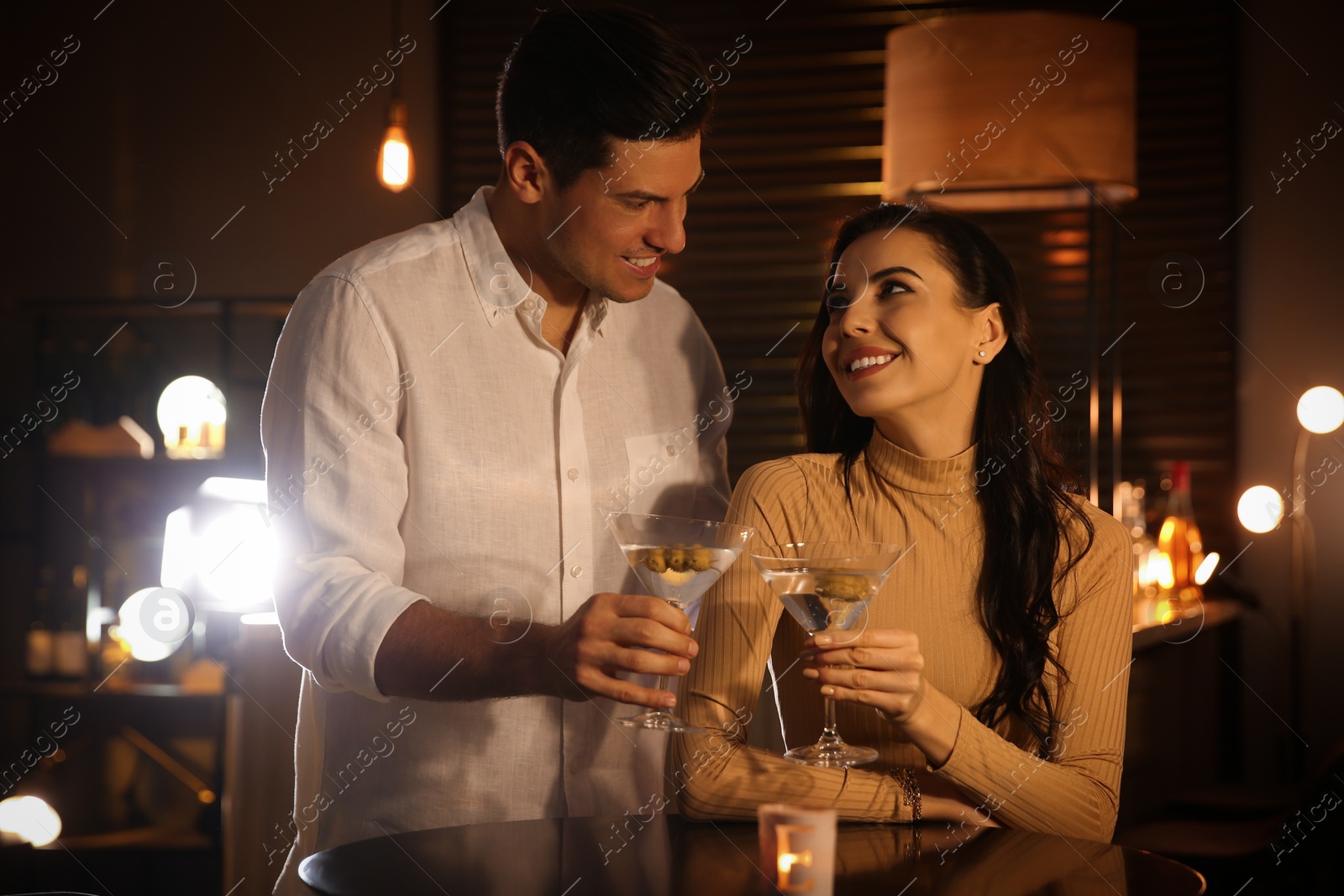 Photo of Man and woman flirting with each other in bar