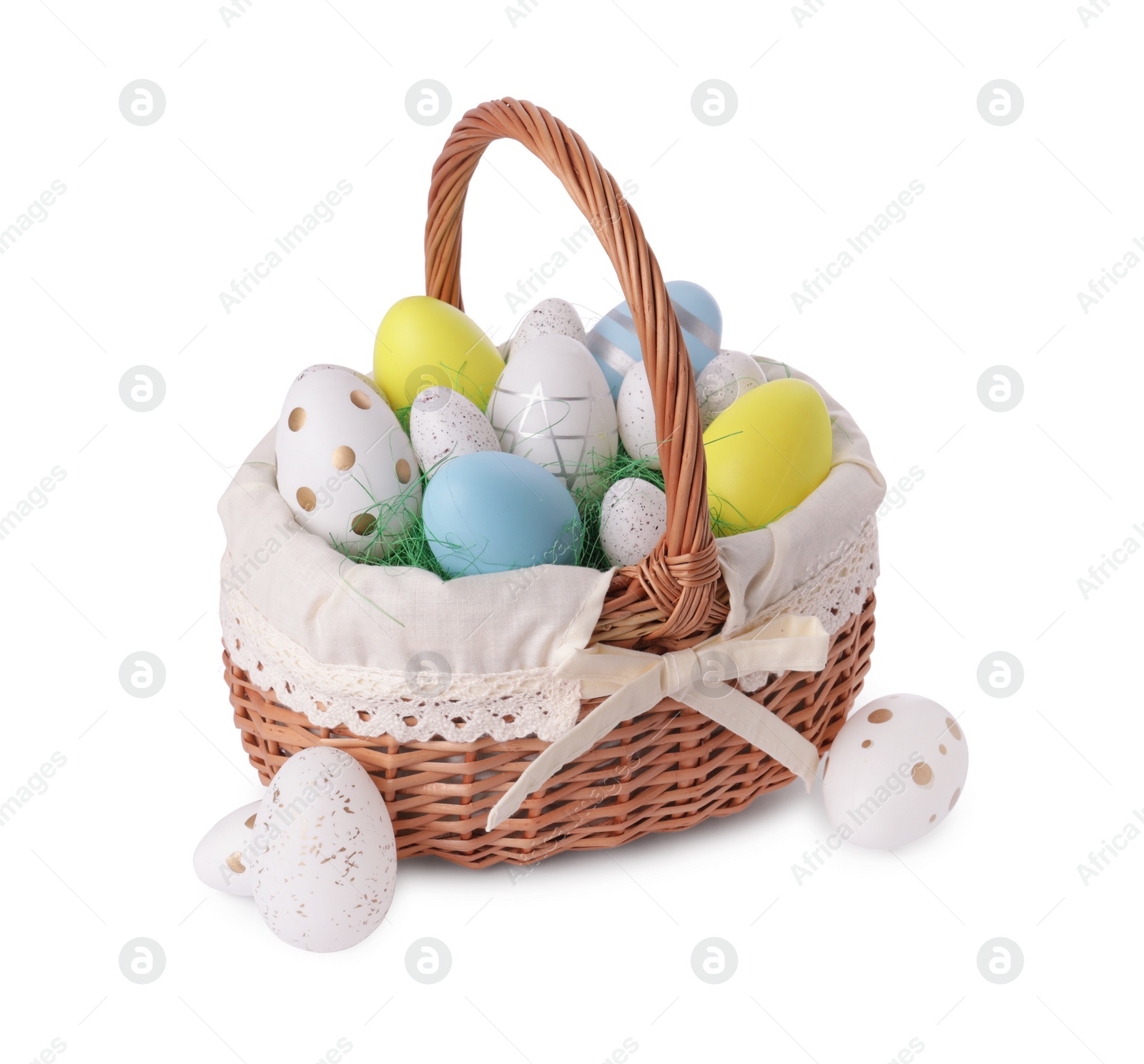 Photo of Wicker basket with beautifully painted Easter eggs isolated on white