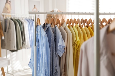 Photo of Collection of stylish women's clothes in modern boutique
