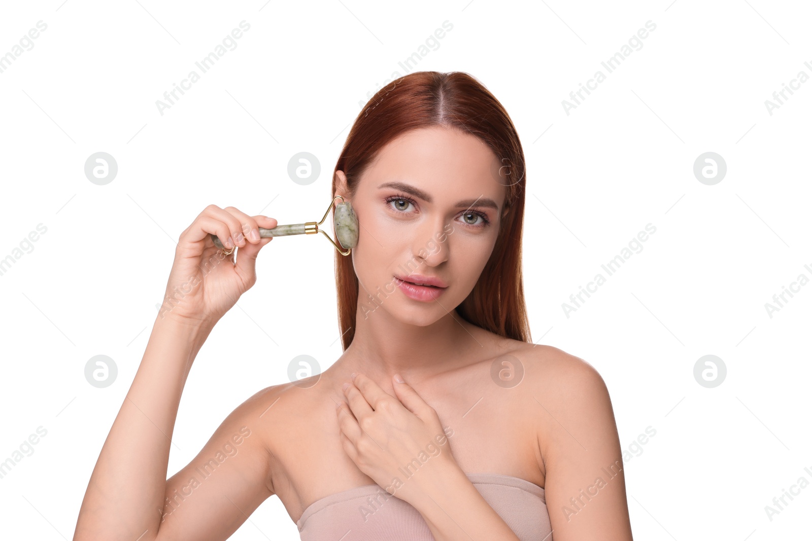 Photo of Young woman massaging her face with jade roller isolated on white