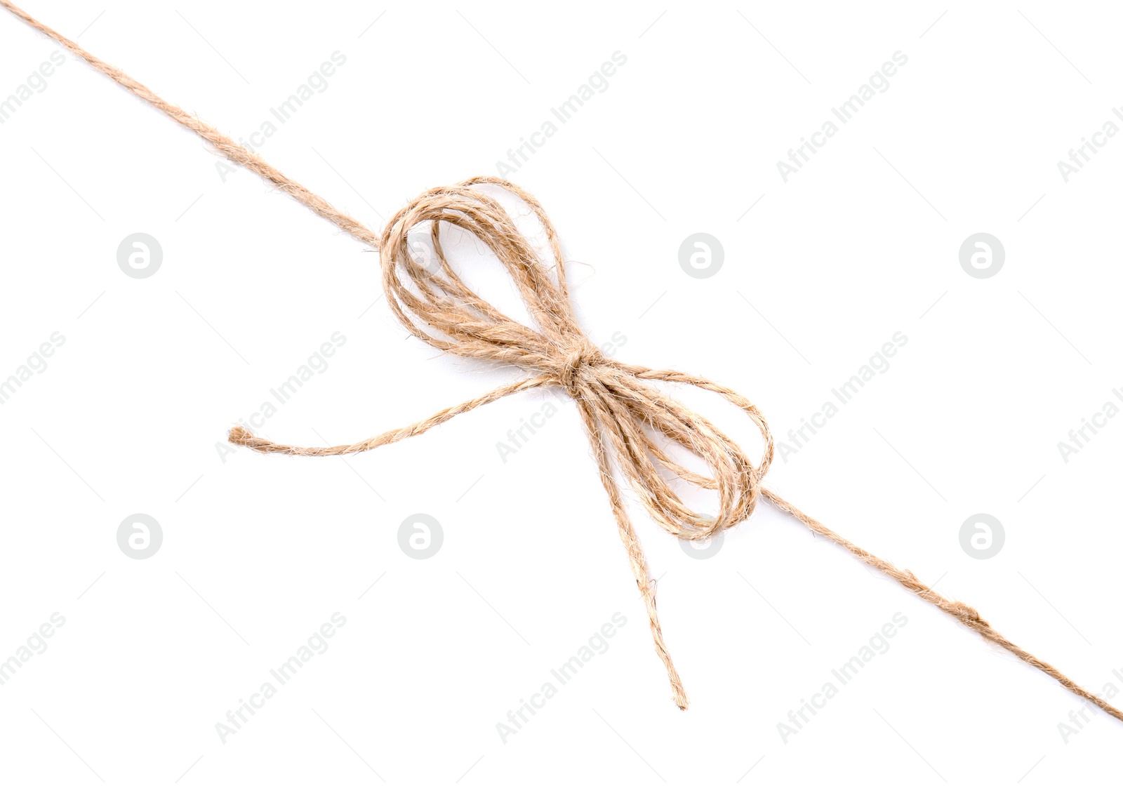 Photo of Linen rope string with bow isolated on white, top view