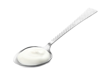 Spoon with yummy yogurt on white background