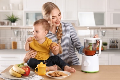 Woman preparing breakfast for her child in kitchen. Healthy baby food