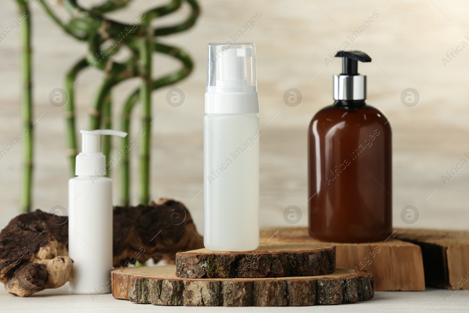 Photo of Bottles of face cleansing products on white table