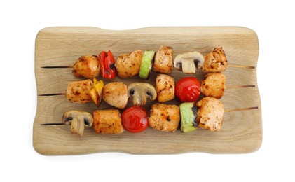 Photo of Wooden board with delicious shish kebabs and grilled vegetables isolated on white, top view