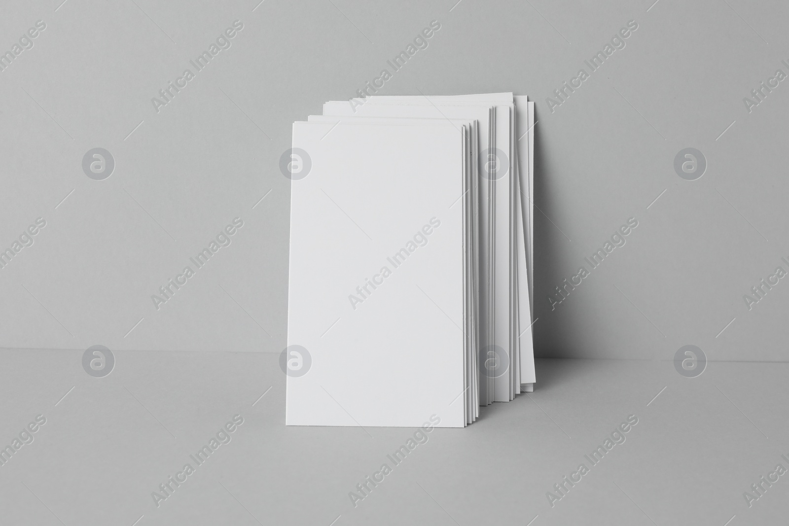 Photo of Blank business cards on light gray background. Mockup for design