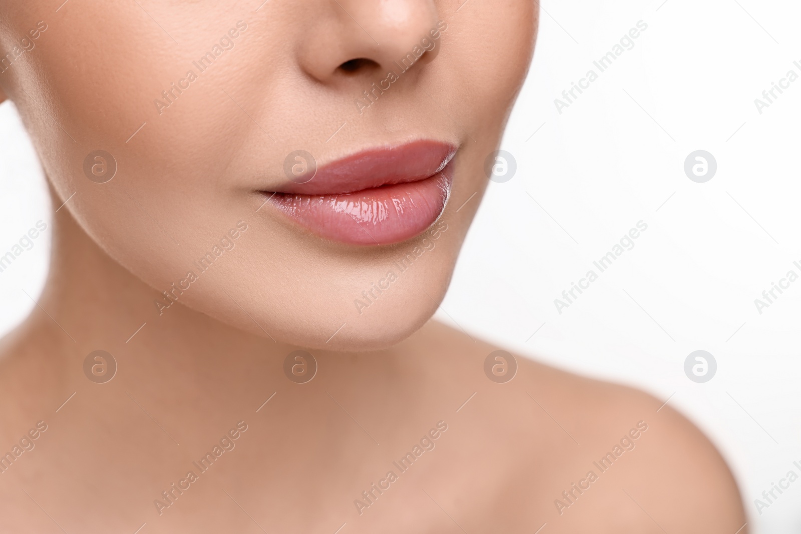 Photo of Woman with beautiful lips on white background, closeup