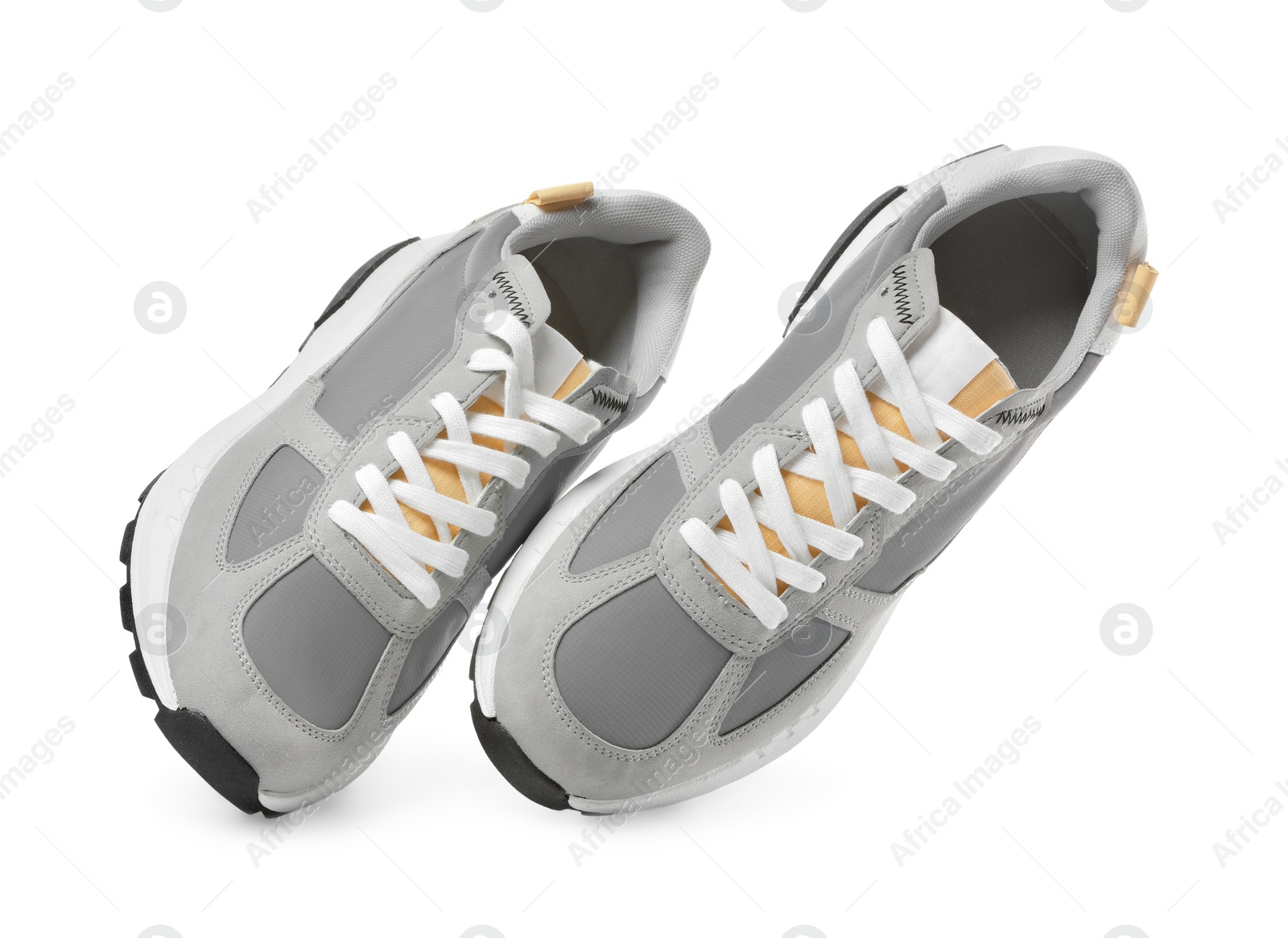 Photo of Pair of stylish grey sneakers isolated on white