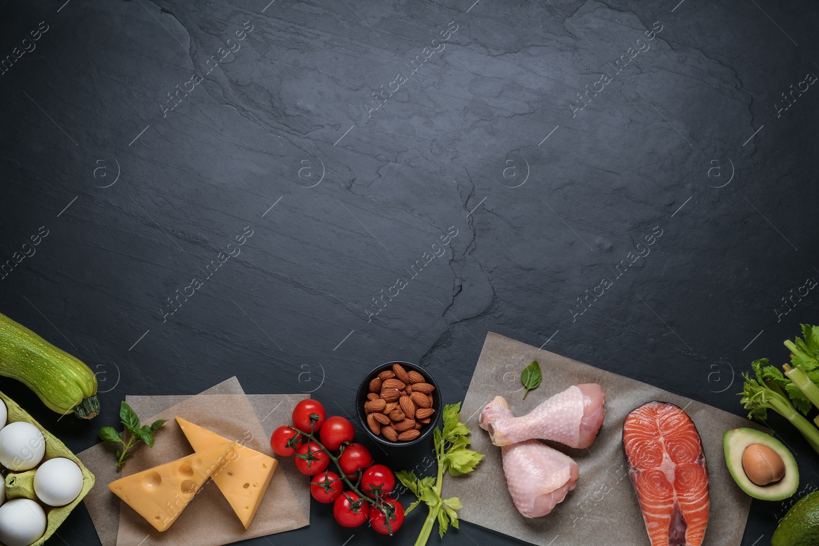 Photo of Flat lay composition with keto diet products on black table, space for text