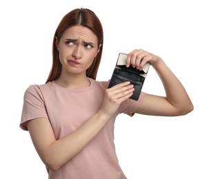 Upset woman with empty wallet on white background