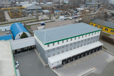 Aerial view of warehouse with loading docks outdoors. Logistics center