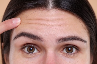 Photo of Closeup view of woman with wrinkles on her forehead