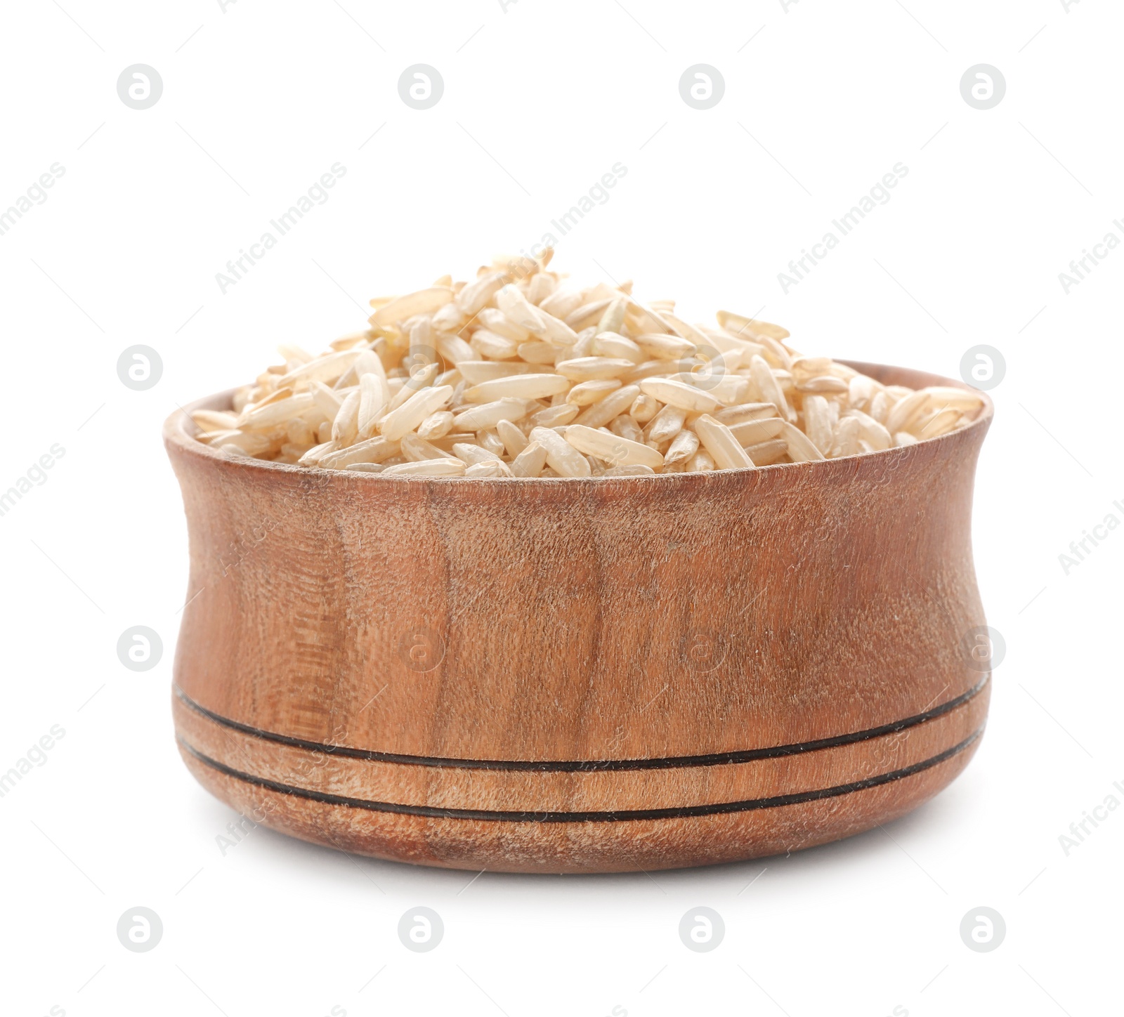 Photo of Wooden bowl with brown rice on white background