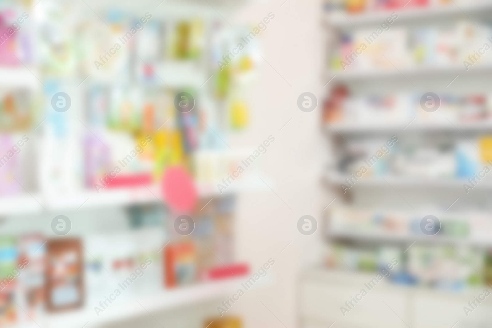 Image of Blurred view of shelves with pharmaceuticals in modern drugstore