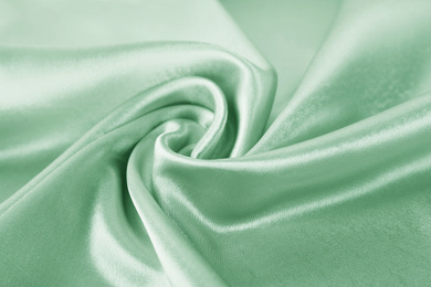 Texture of beautiful silk as background. Image toned in mint color 