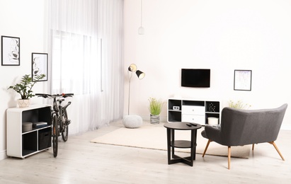 Light living room interior with modern bicycle