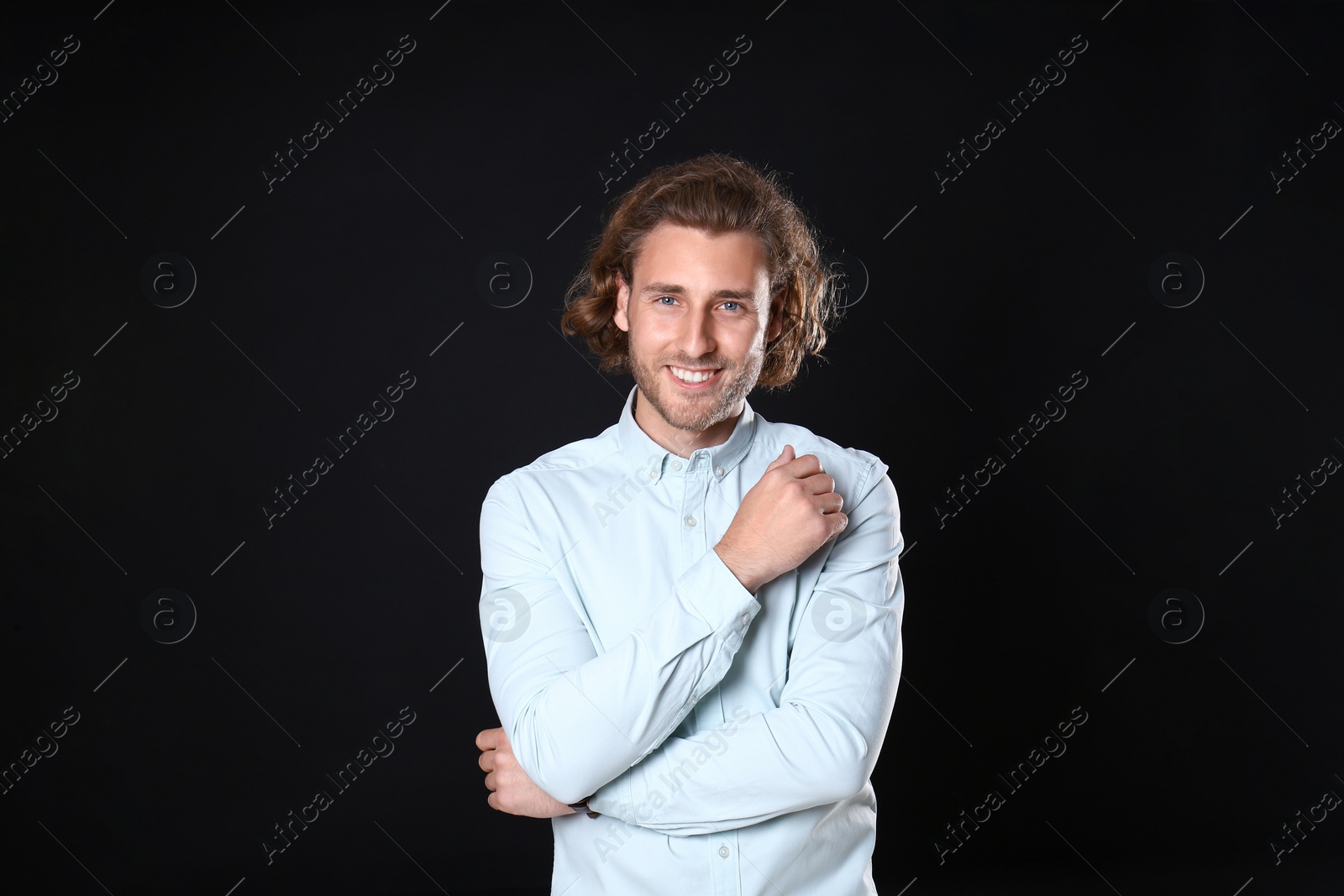 Photo of Portrait of handsome man on black background