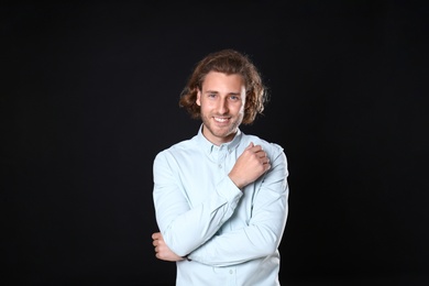 Photo of Portrait of handsome man on black background