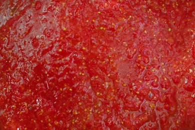 Photo of Red tomato juice as background, closeup view