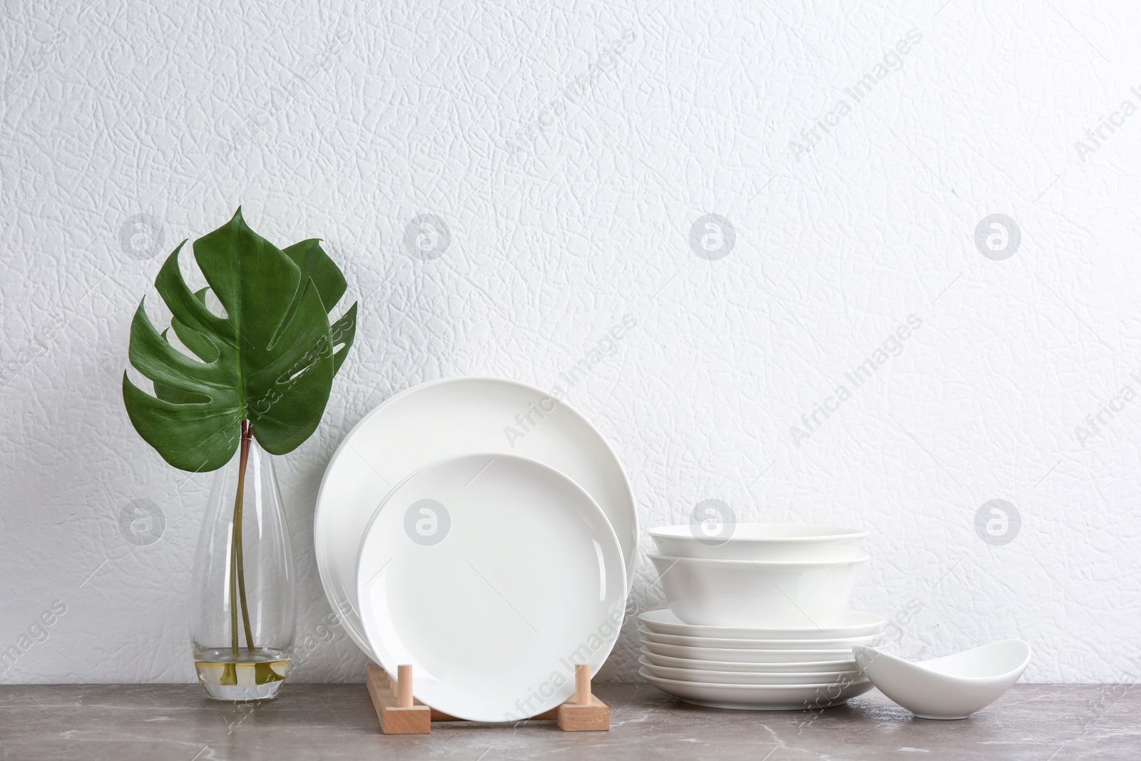 Photo of Set of new ceramic dishware on table