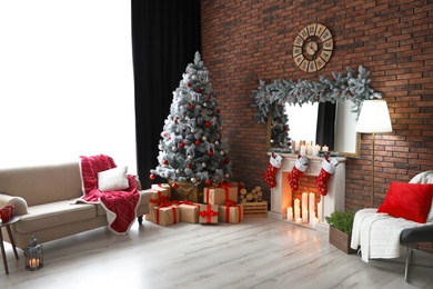 Stylish room interior with beautiful Christmas tree