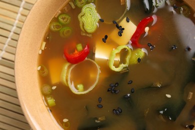 Bowl of delicious miso soup with tofu, top view