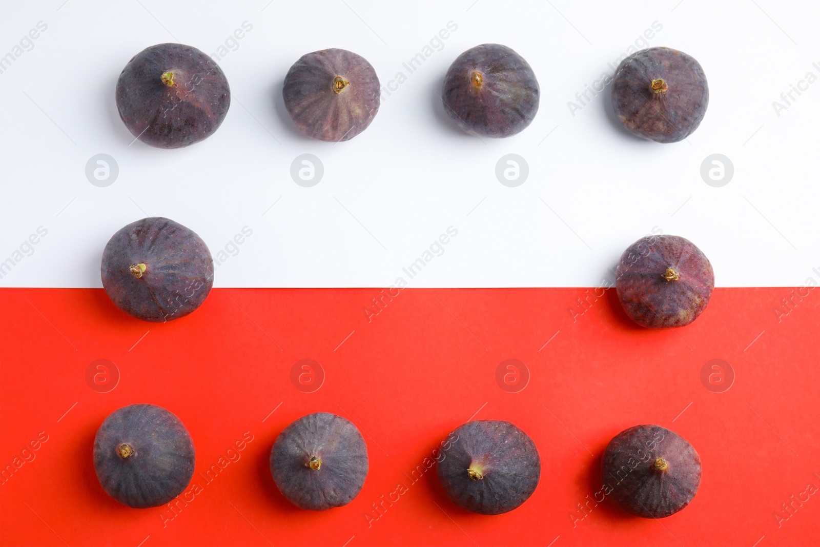 Photo of Delicious ripe figs on color background, flat lay. Space for text