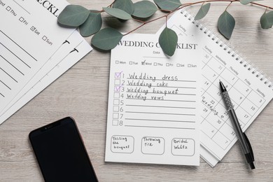 Photo of Flat lay composition with Wedding Checklist and calendar on wooden table