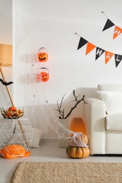 Photo of Modern room decorated for Halloween. Festive interior