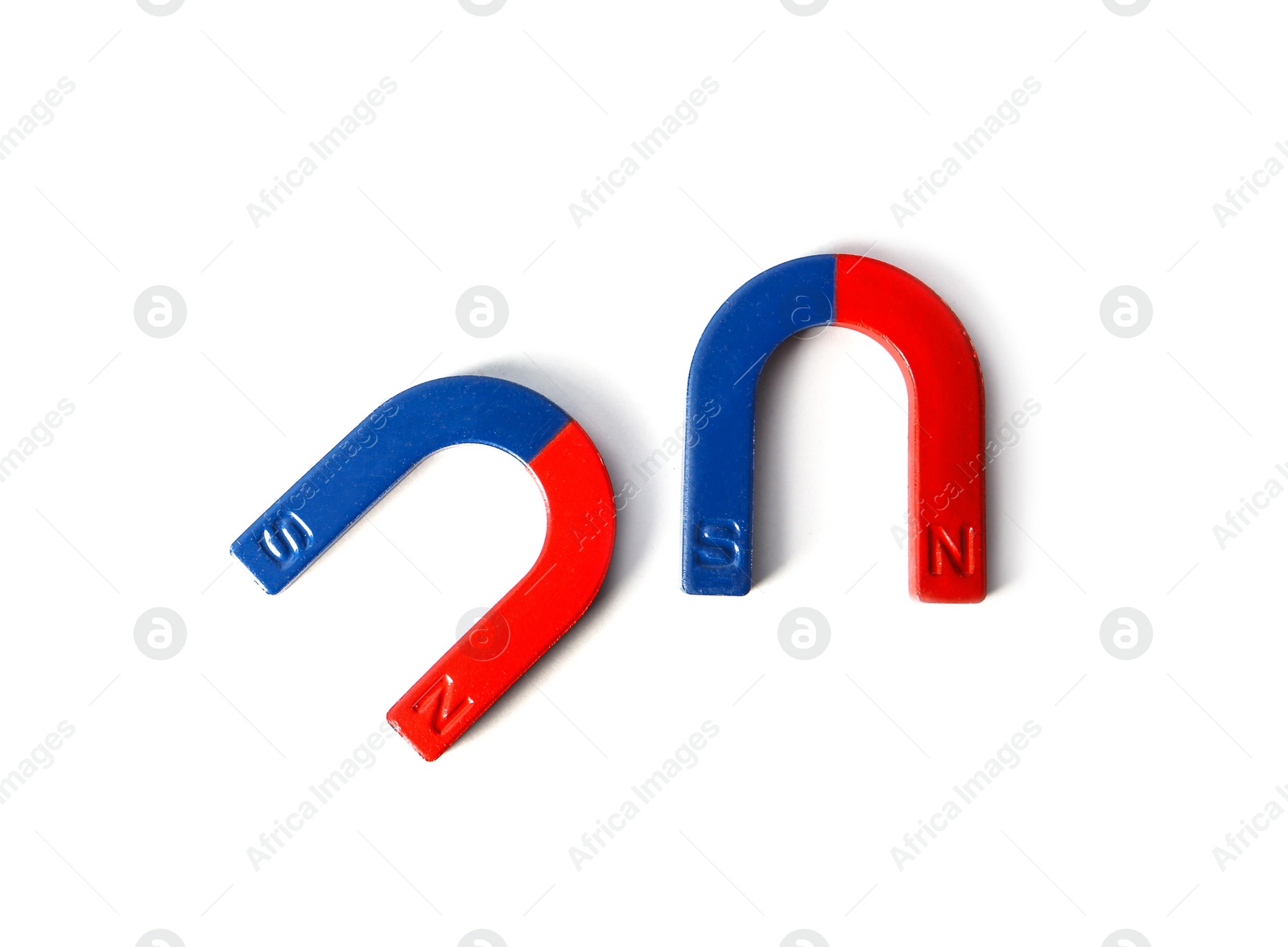 Photo of Red and blue horseshoe magnets isolated on white, top view