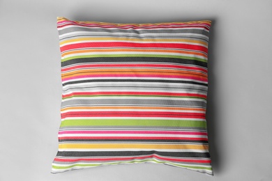 Soft decorative pillow on light background