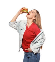 Pretty woman eating tasty burger isolated on white