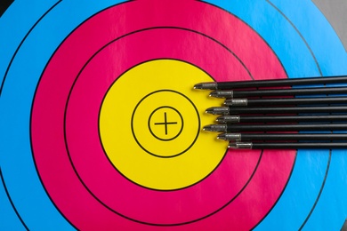Photo of Many arrows on archery target, top view