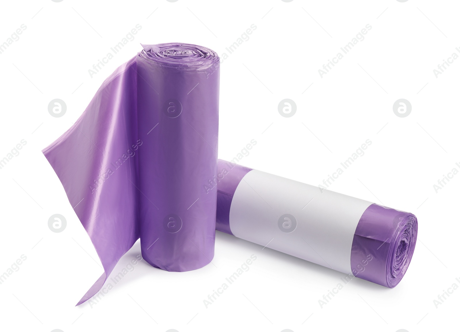 Photo of Rolls of garbage bags on white background. Cleaning supplies