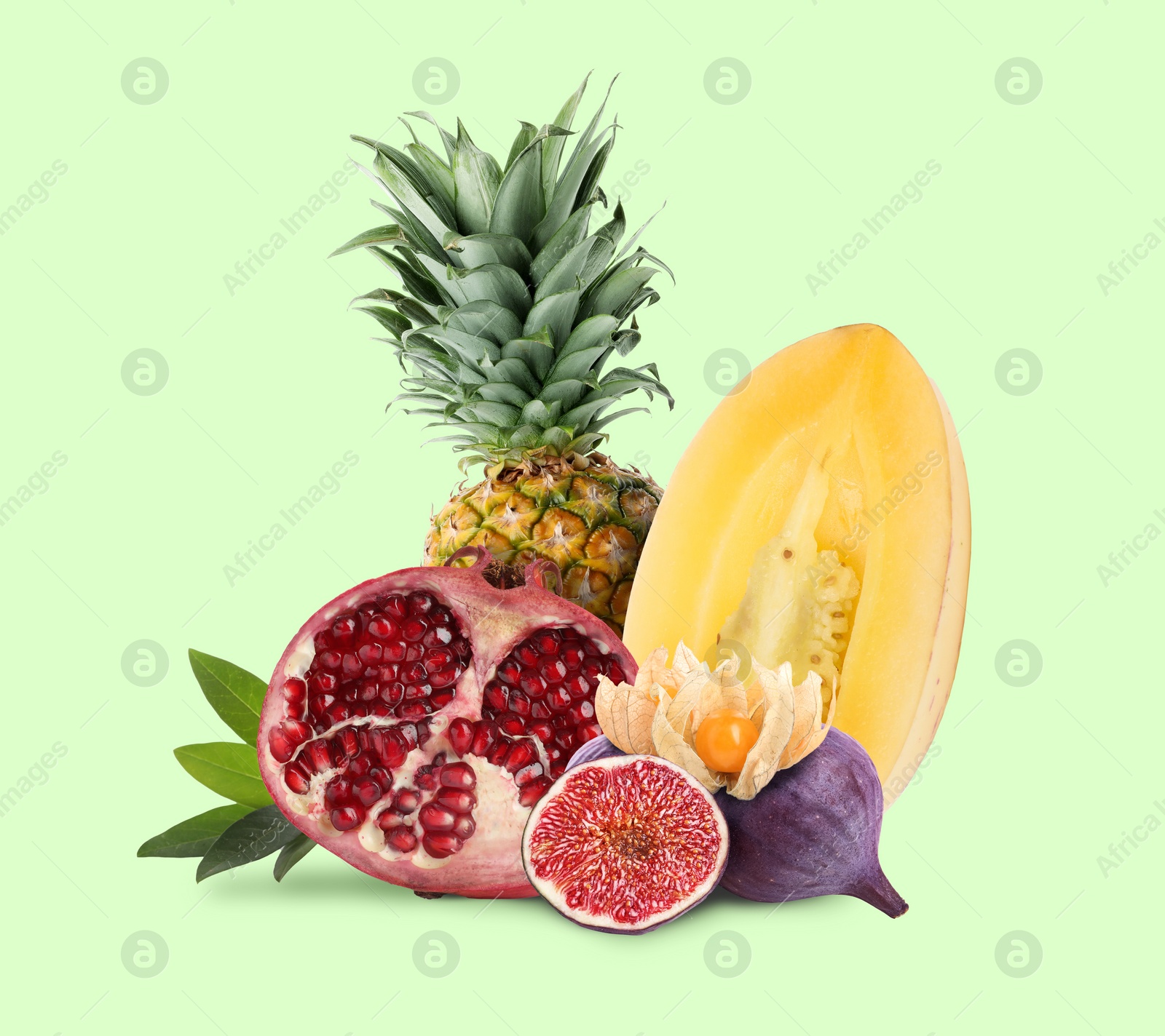 Image of Many different fresh fruits on pastel light green background