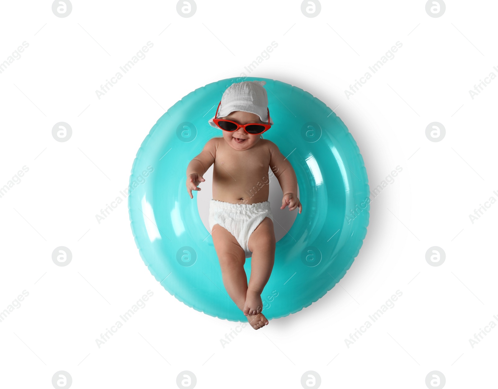 Photo of Cute little baby in sunglasses with inflatable ring on white background, top view