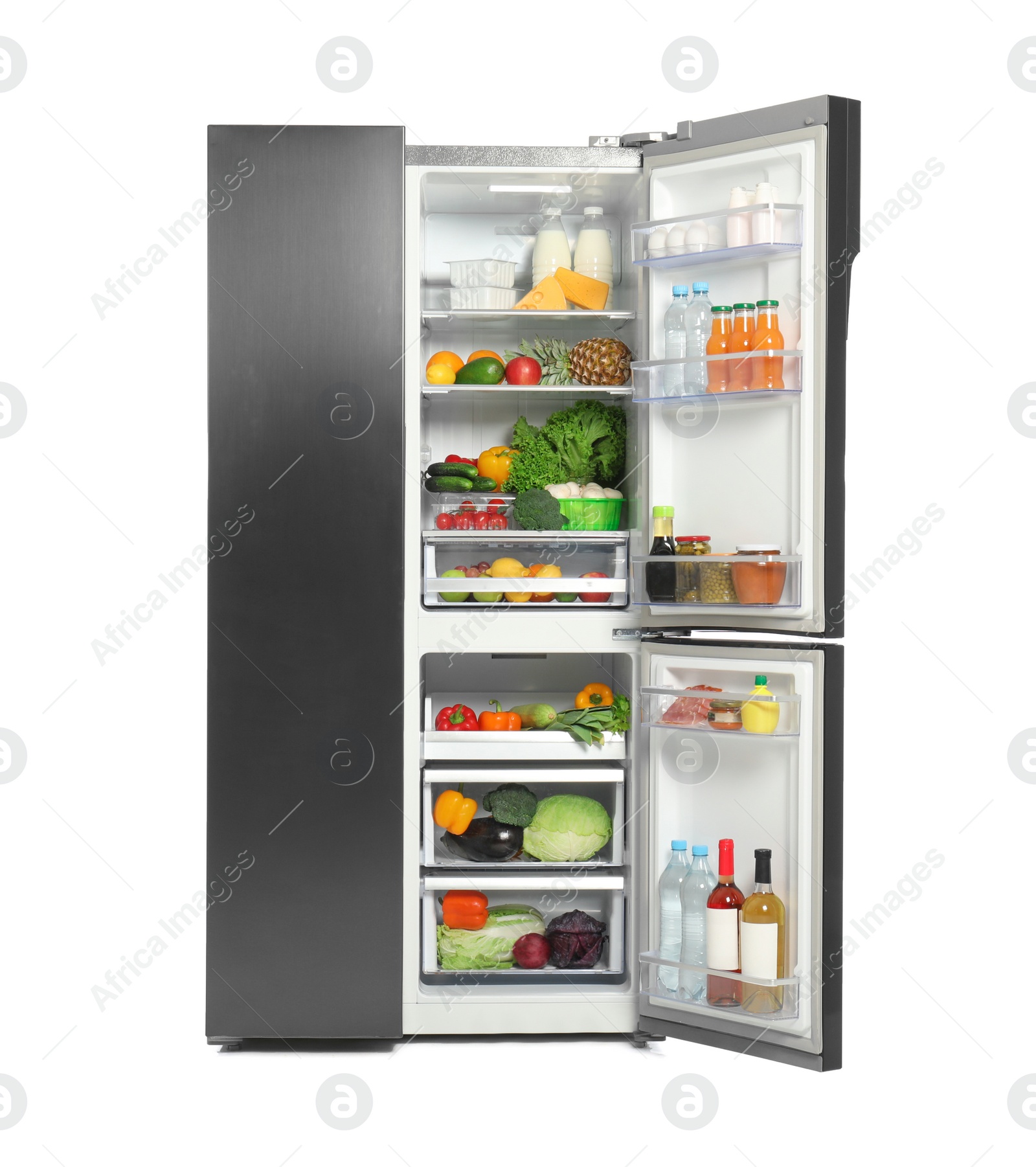 Photo of Open refrigerator full of different products isolated on white