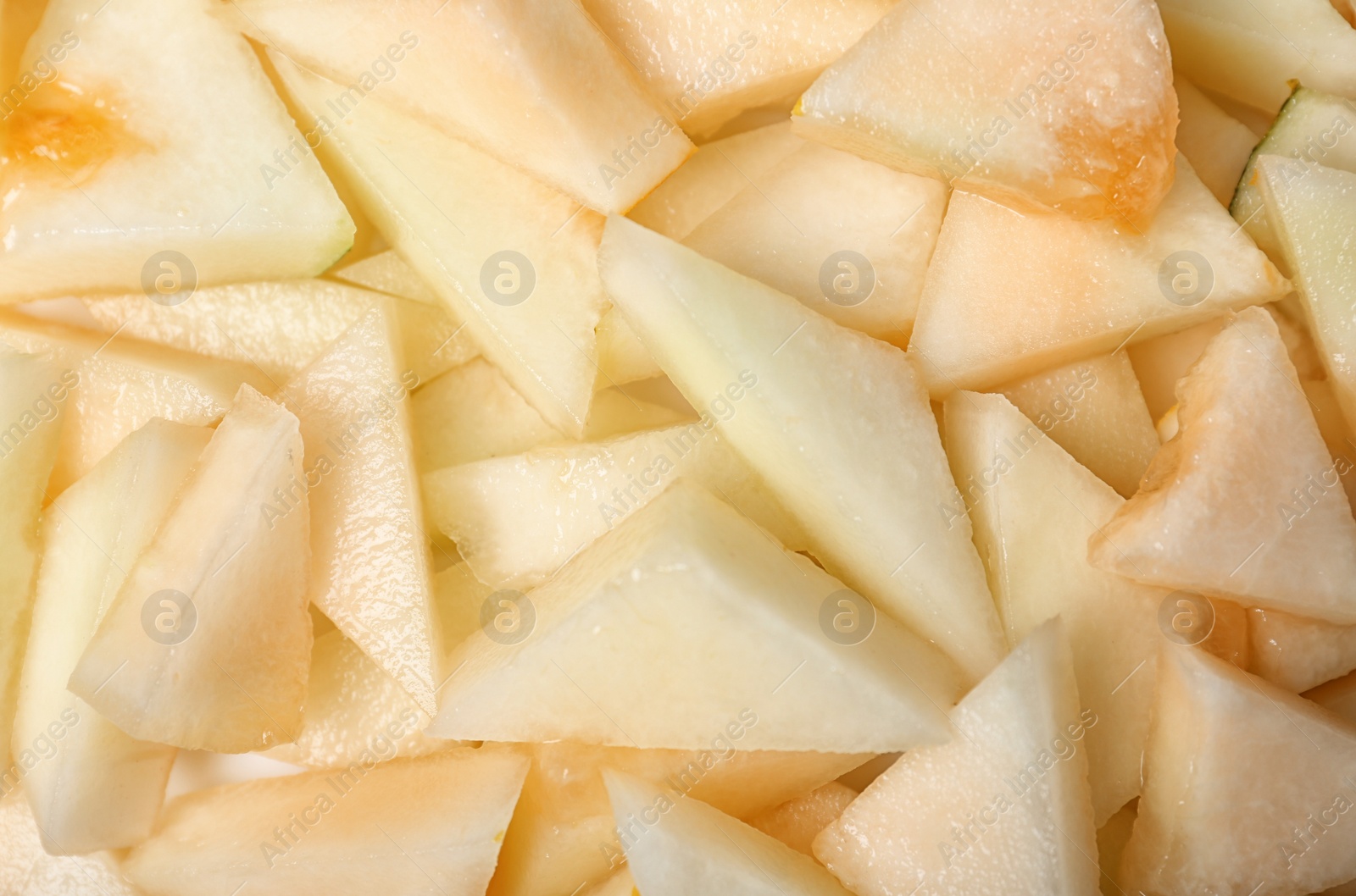 Photo of Ripe tasty melon slices as background, closeup view