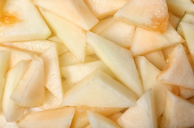 Ripe tasty melon slices as background, closeup view