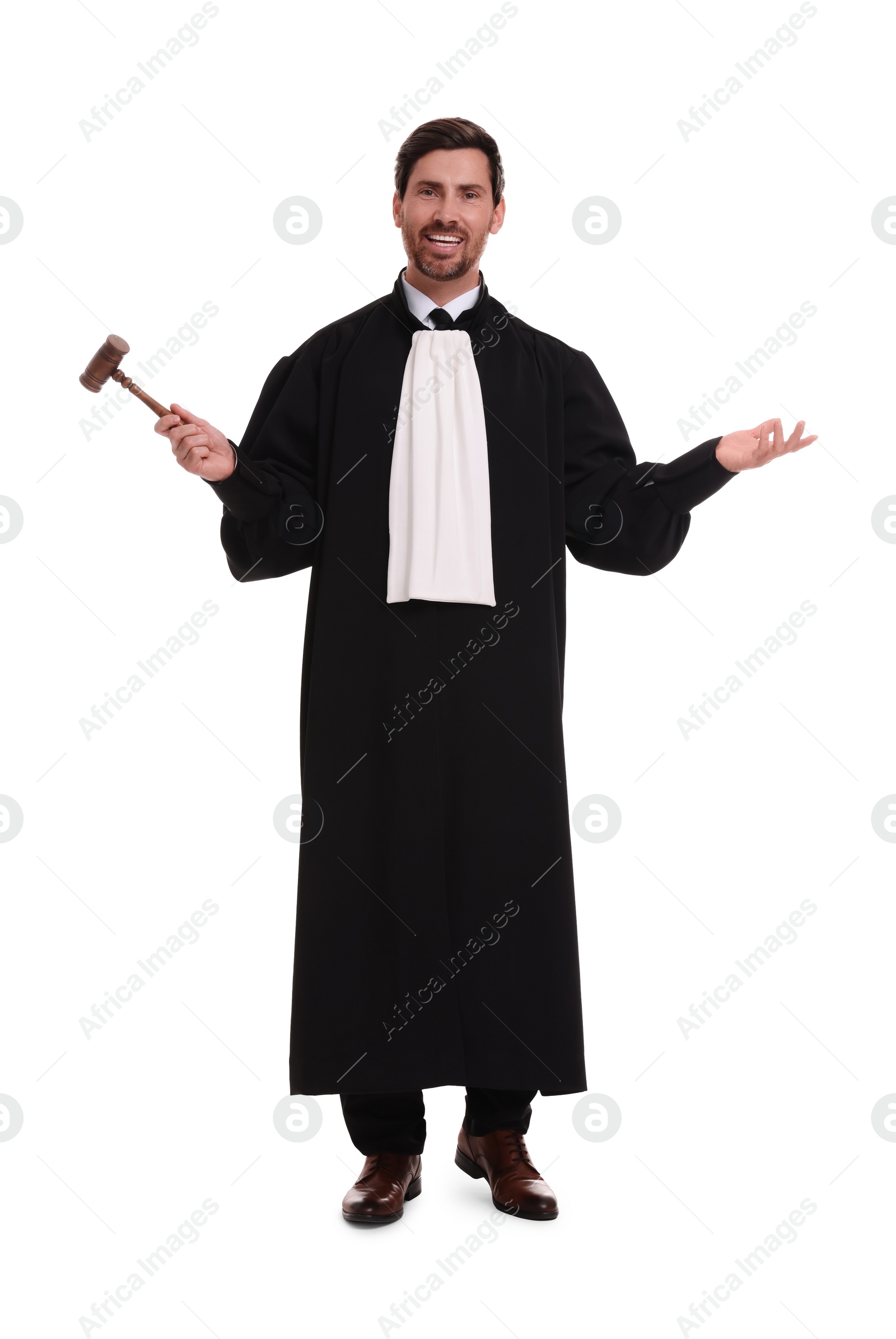 Photo of Smiling judge with gavel on white background