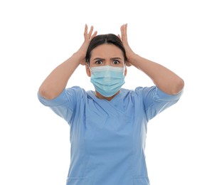 Photo of Portrait of nurse in protective mask feeling fear on white background