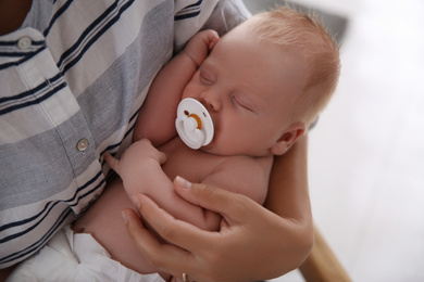 Mother with her newborn baby, closeup view