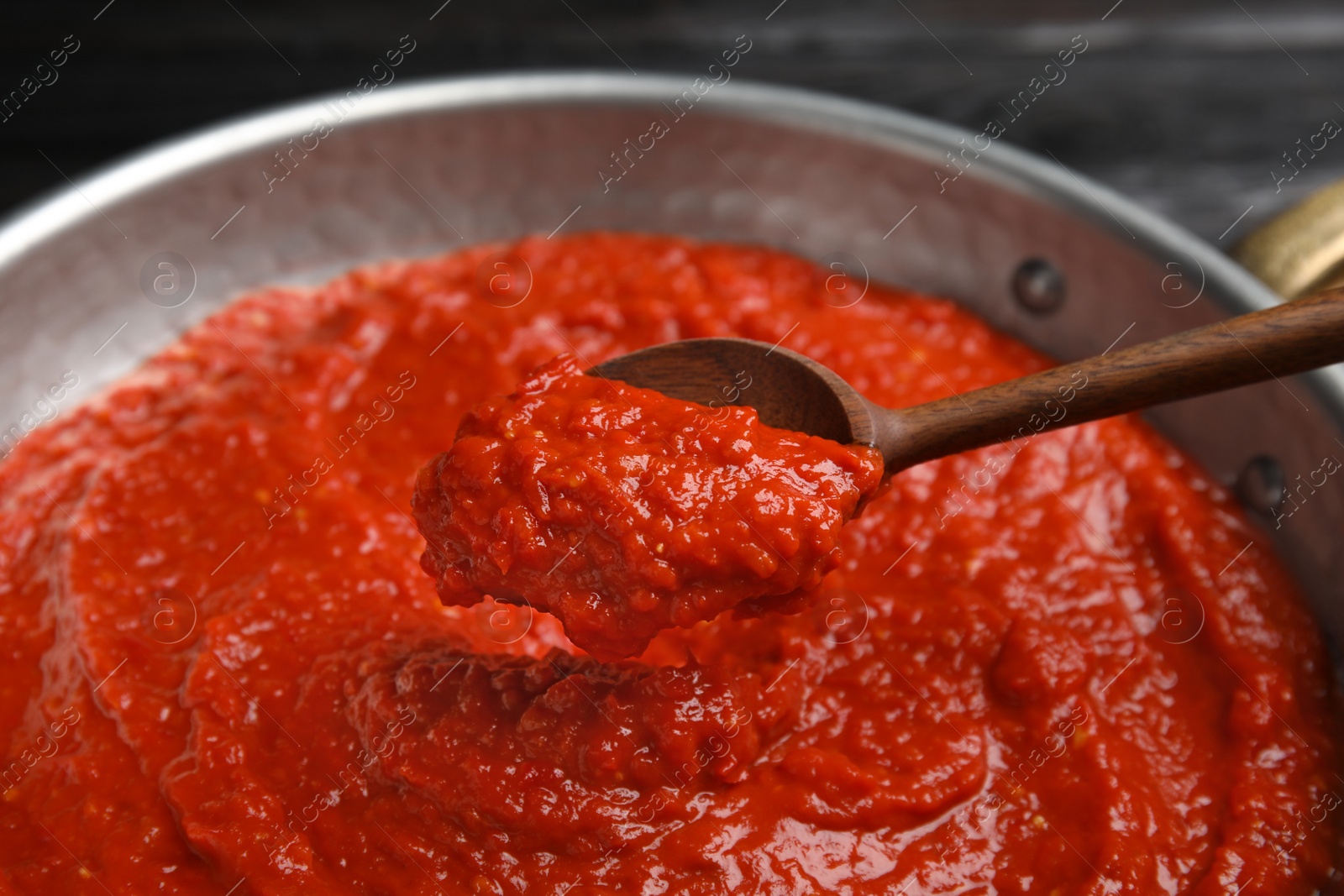 Photo of Delicious tomato sauce in pan, closeup view