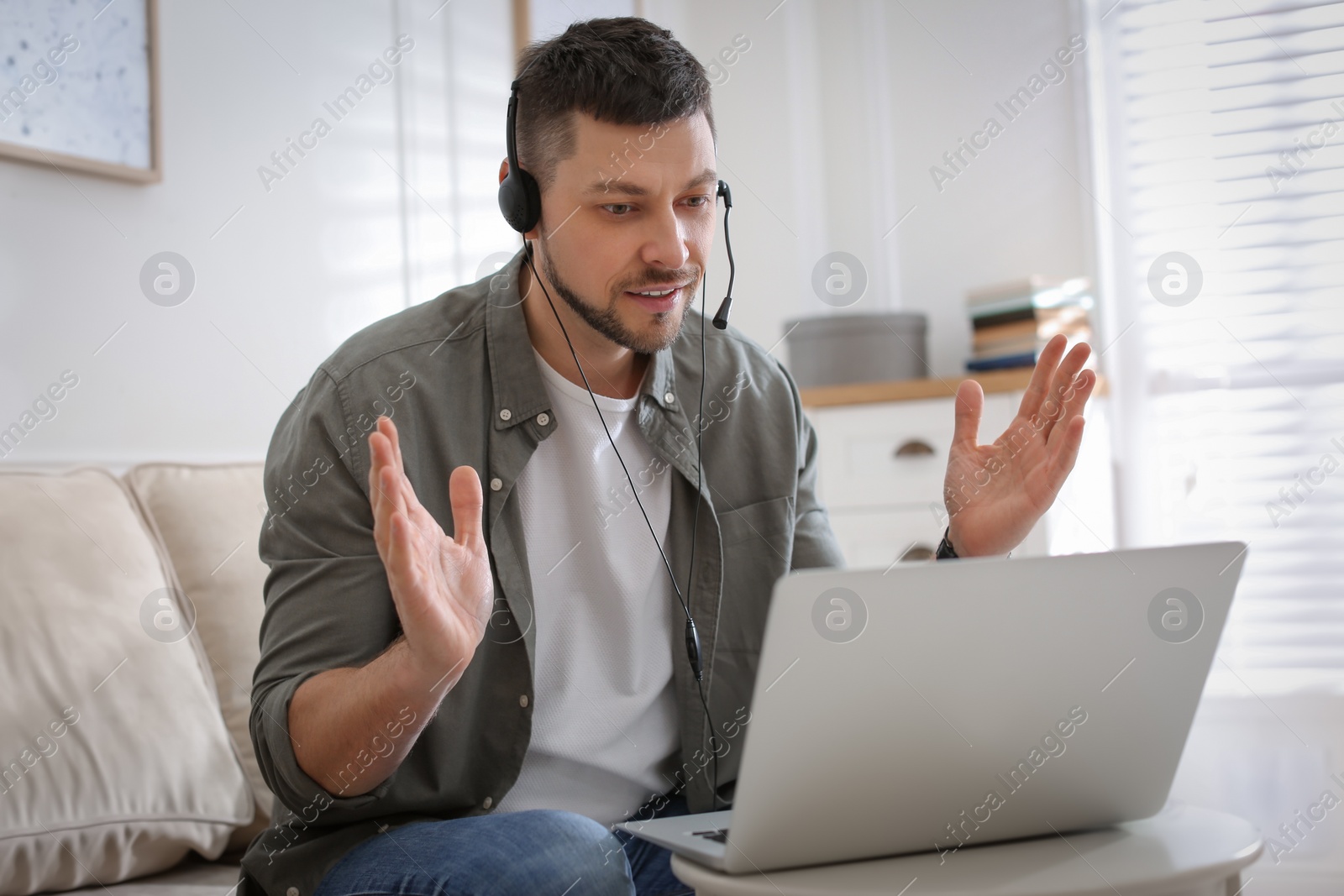 Photo of Teacher conducting online lesson at home during COVID-19 quarantine